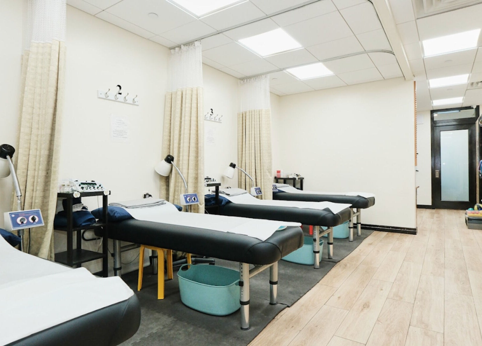 Tranquil therapy room at Healthkey Group Medspa - Flushing, New York, New York, US with massage tables.