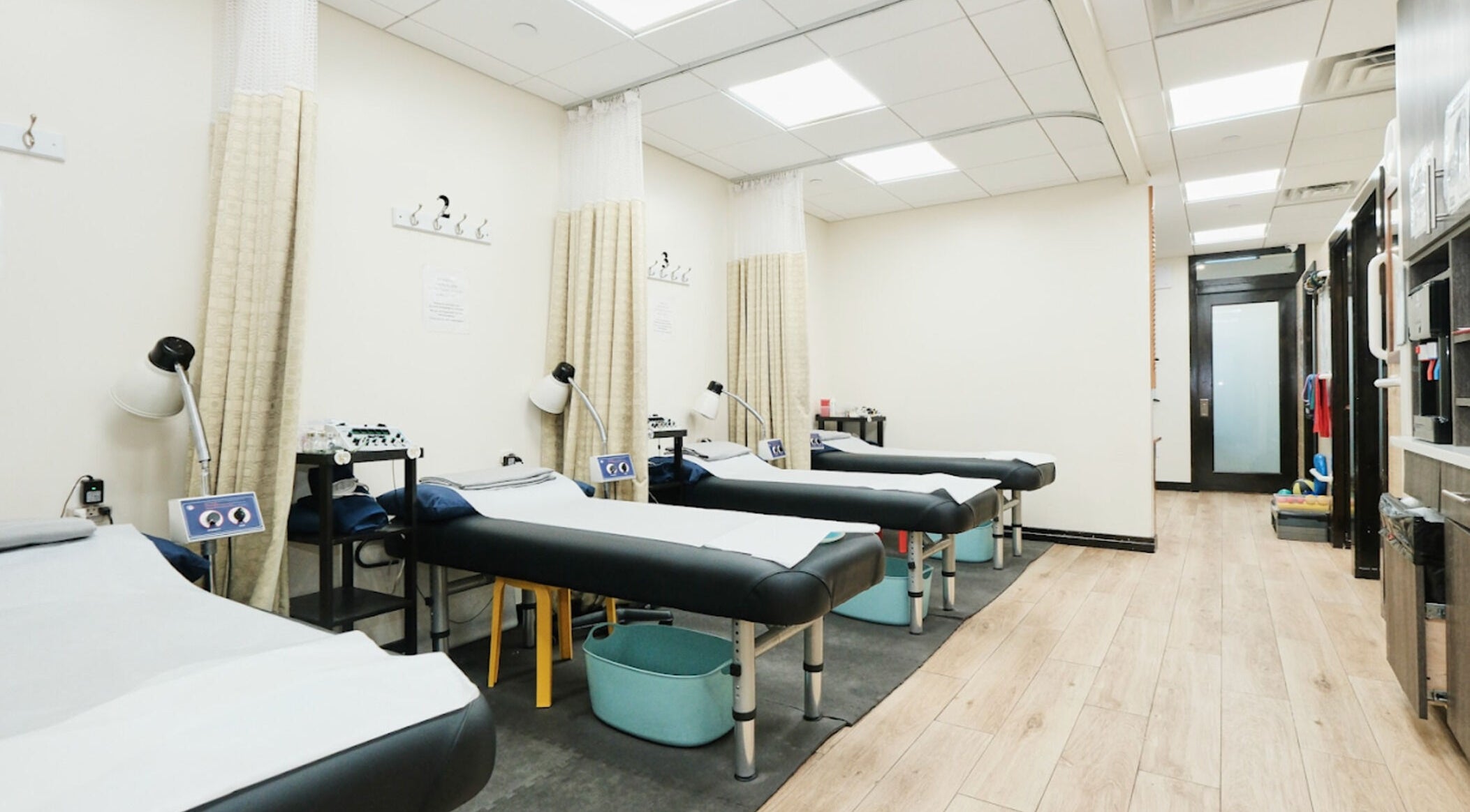 Tranquil therapy room at Healthkey Group Medspa - Flushing, New York, New York, US with massage tables.