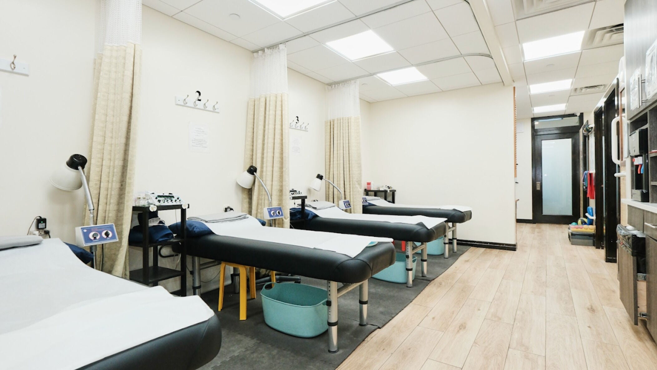 Tranquil therapy room at Healthkey Group Medspa - Flushing, New York, New York, US with massage tables.