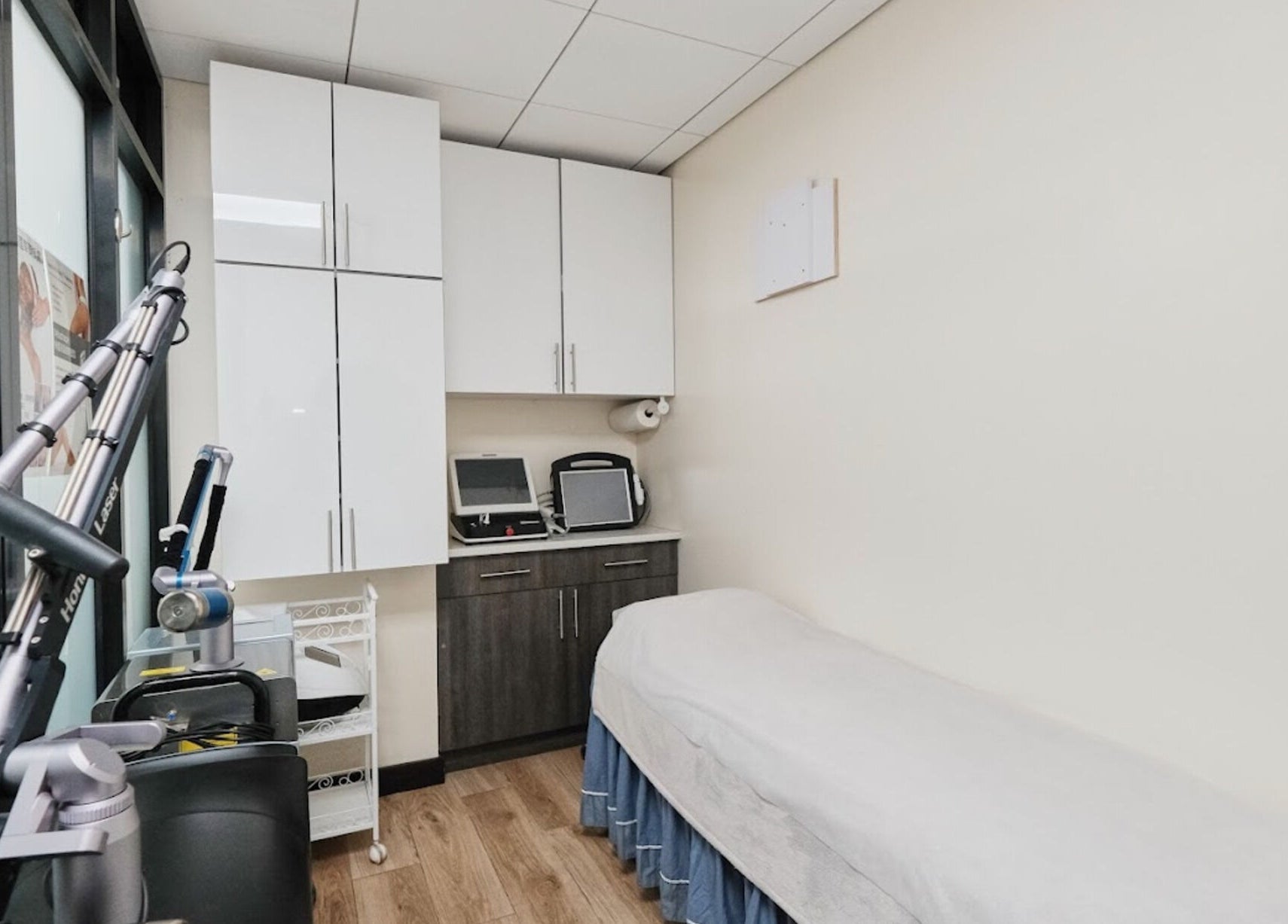 Treatment room at Healthkey Group Medspa - Flushing, New York, New York, US equipped with modern aesthetics equipment.