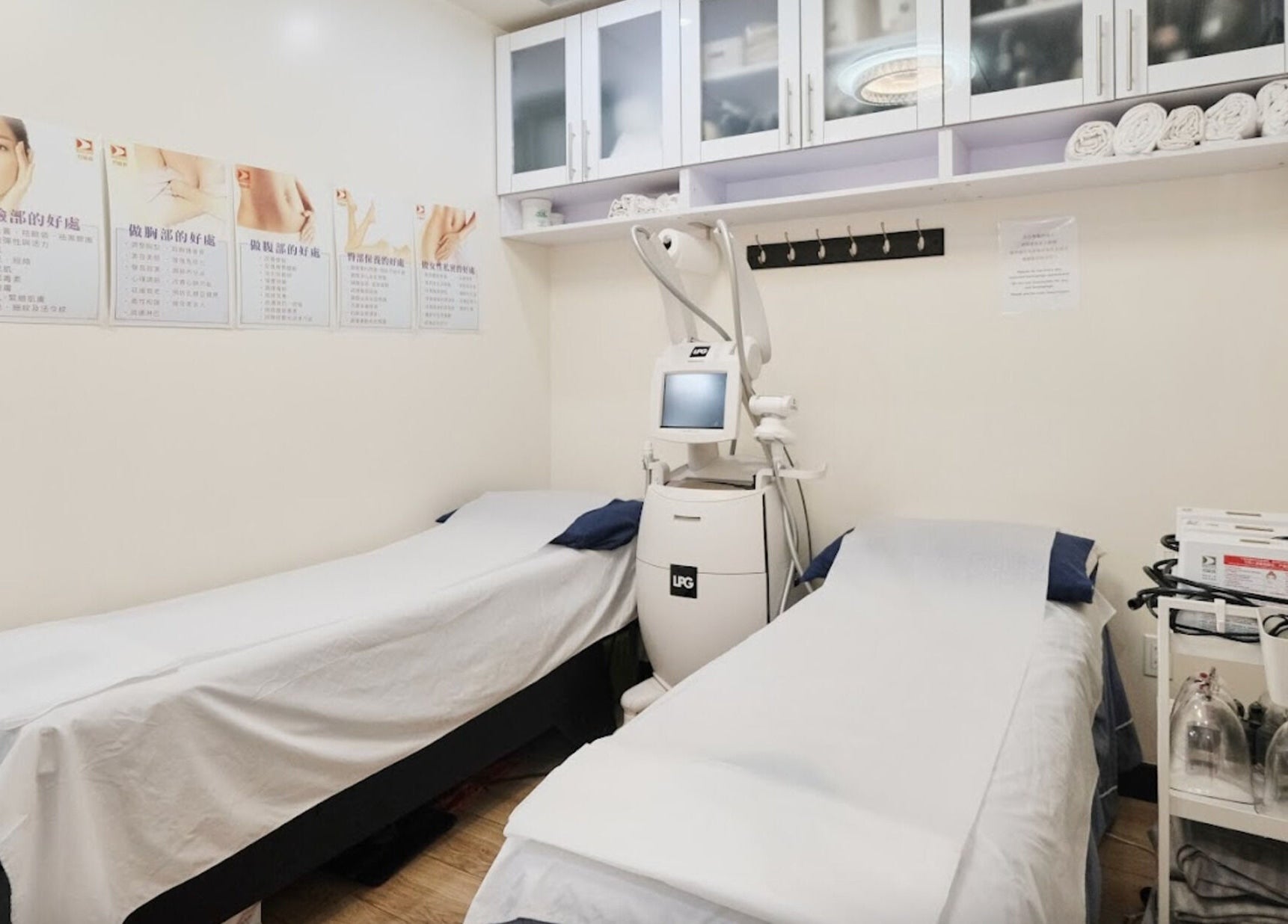 Calm treatment room at Healthkey Group Medspa - Flushing, New York, New York, US with two beds and equipment.