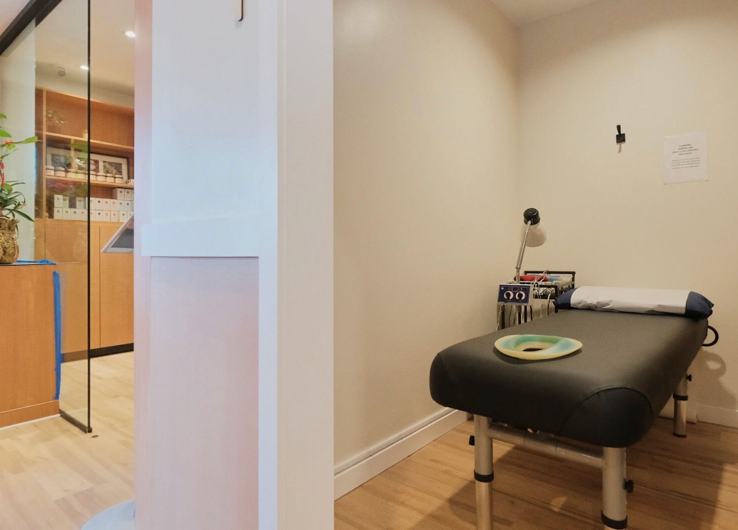 Relaxing therapy room at Healthkey Group Wellington - Elmhurst in New York, New York, US with massage table.