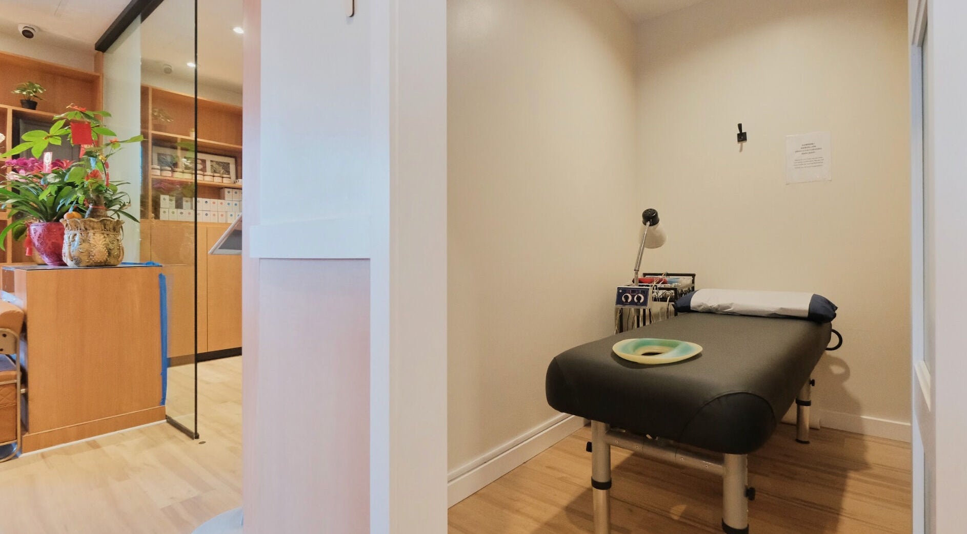 Relaxing therapy room at Healthkey Group Wellington - Elmhurst in New York, New York, US with massage table.