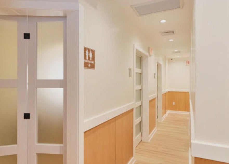 Bright hallway at Healthkey Group Wellington - Elmhurst in New York, New York, US offering a calming ambiance.