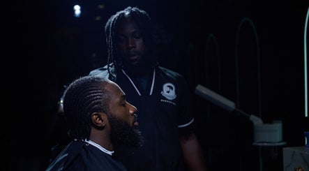 A barber works at Man Cave By Modern Man, Abuja, offering specialized grooming services for men.