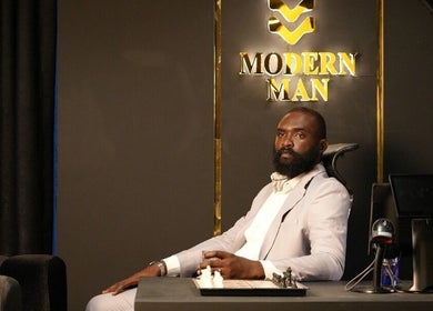 Man sitting in a sophisticated space at Man Cave By Modern Man, Abuja, Federal Capital Territory, NG.
