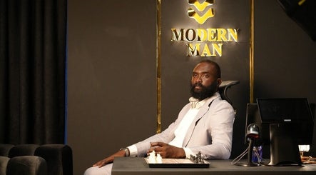 Man sitting in a sophisticated space at Man Cave By Modern Man, Abuja, Federal Capital Territory, NG.