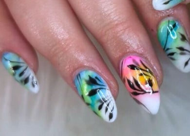 Colorful nail art at TranQuility in Middelburg, Mpumalanga, ZA, showcasing vibrant leaf designs.