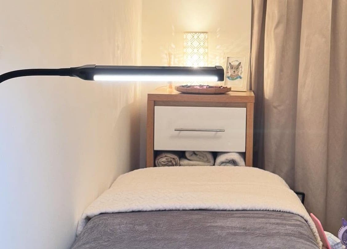 Relaxing treatment room with soft lighting at Curl Lashes, Bristol, England, GB.