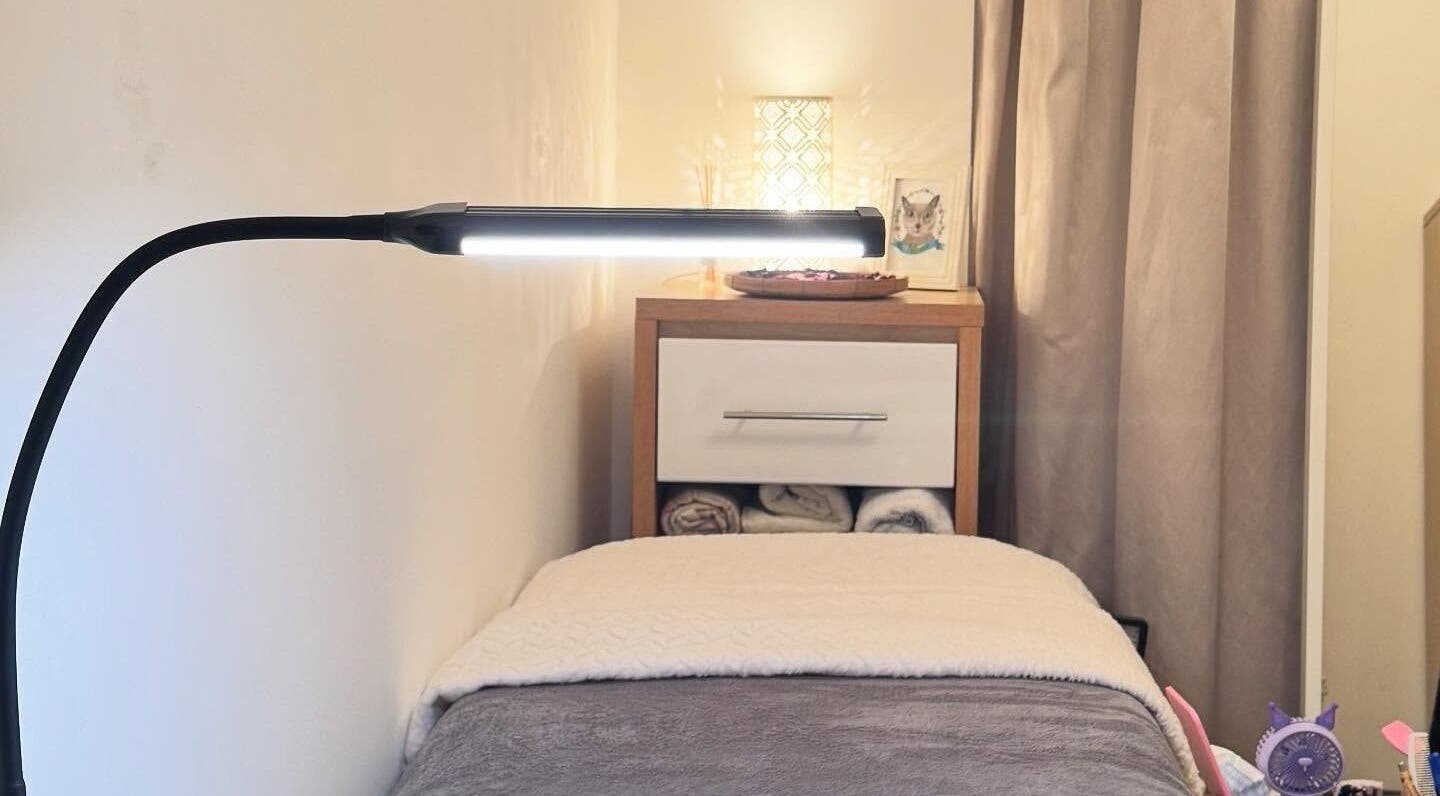 Relaxing treatment room with soft lighting at Curl Lashes, Bristol, England, GB.