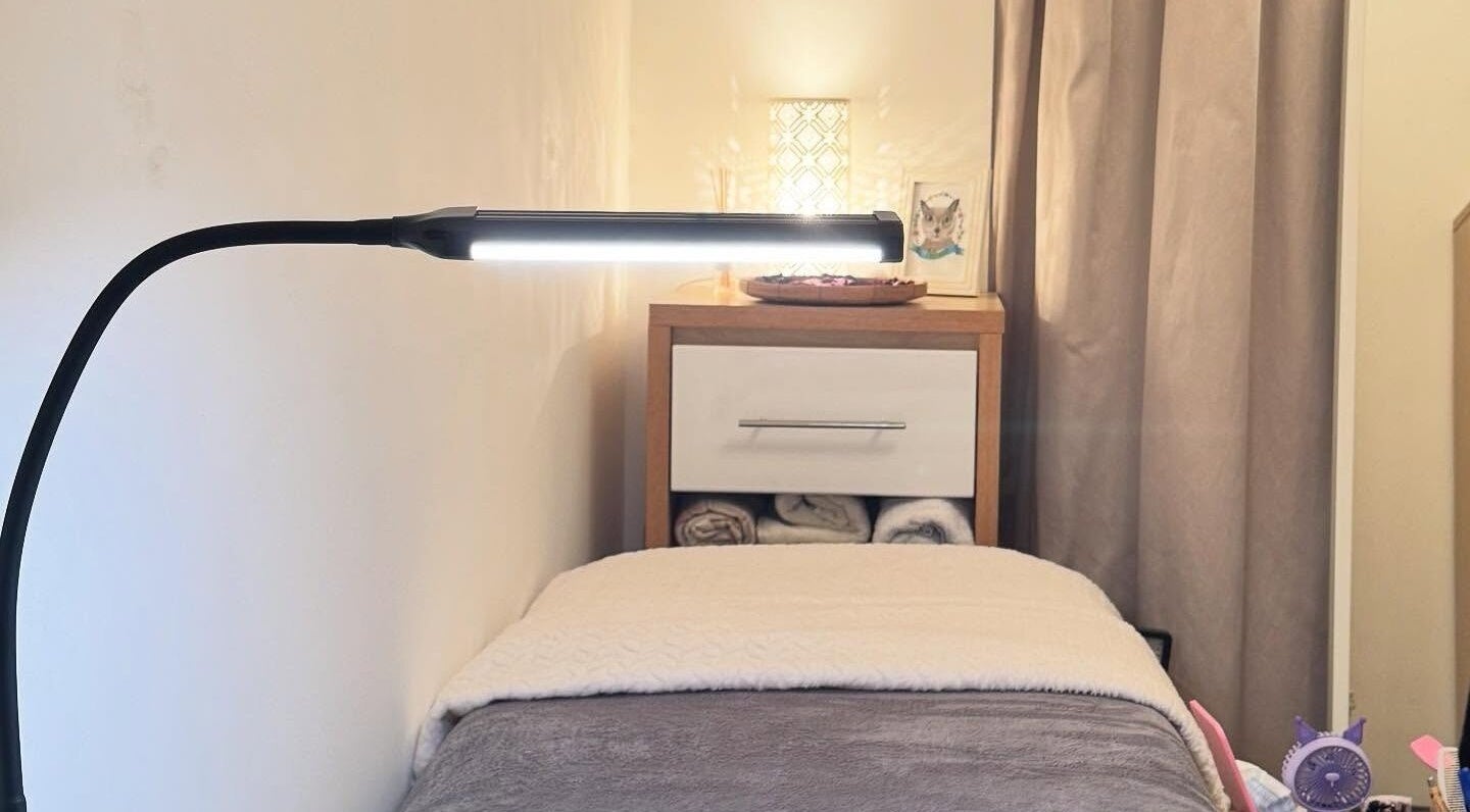 Relaxing treatment room with soft lighting at Curl Lashes, Bristol, England, GB.