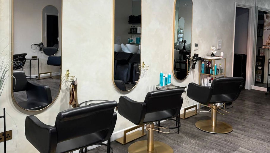 Chic modern salon chairs at The Coven Hair Lounge, Aylesbury, England, GB. Stylish and inviting atmosphere.