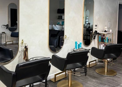 Chic modern salon chairs at The Coven Hair Lounge, Aylesbury, England, GB. Stylish and inviting atmosphere.