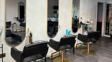 Chic modern salon chairs at The Coven Hair Lounge, Aylesbury, England, GB. Stylish and inviting atmosphere.