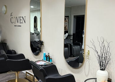 Elegant styling stations at The Coven Hair Lounge, Aylesbury, England, GB, showcasing modern salon design.