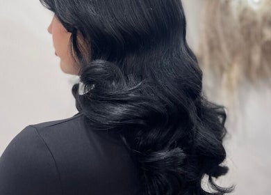 Luxurious black curls styled at The Coven Hair Lounge, Aylesbury, England, GB.