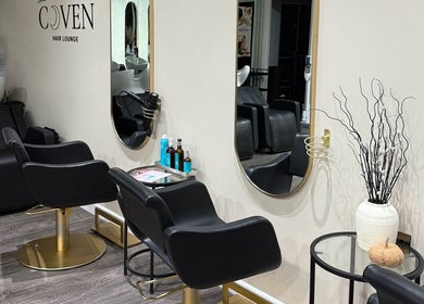 Modern salon chairs and mirrors at The Coven Hair Lounge, Aylesbury, England, GB.
