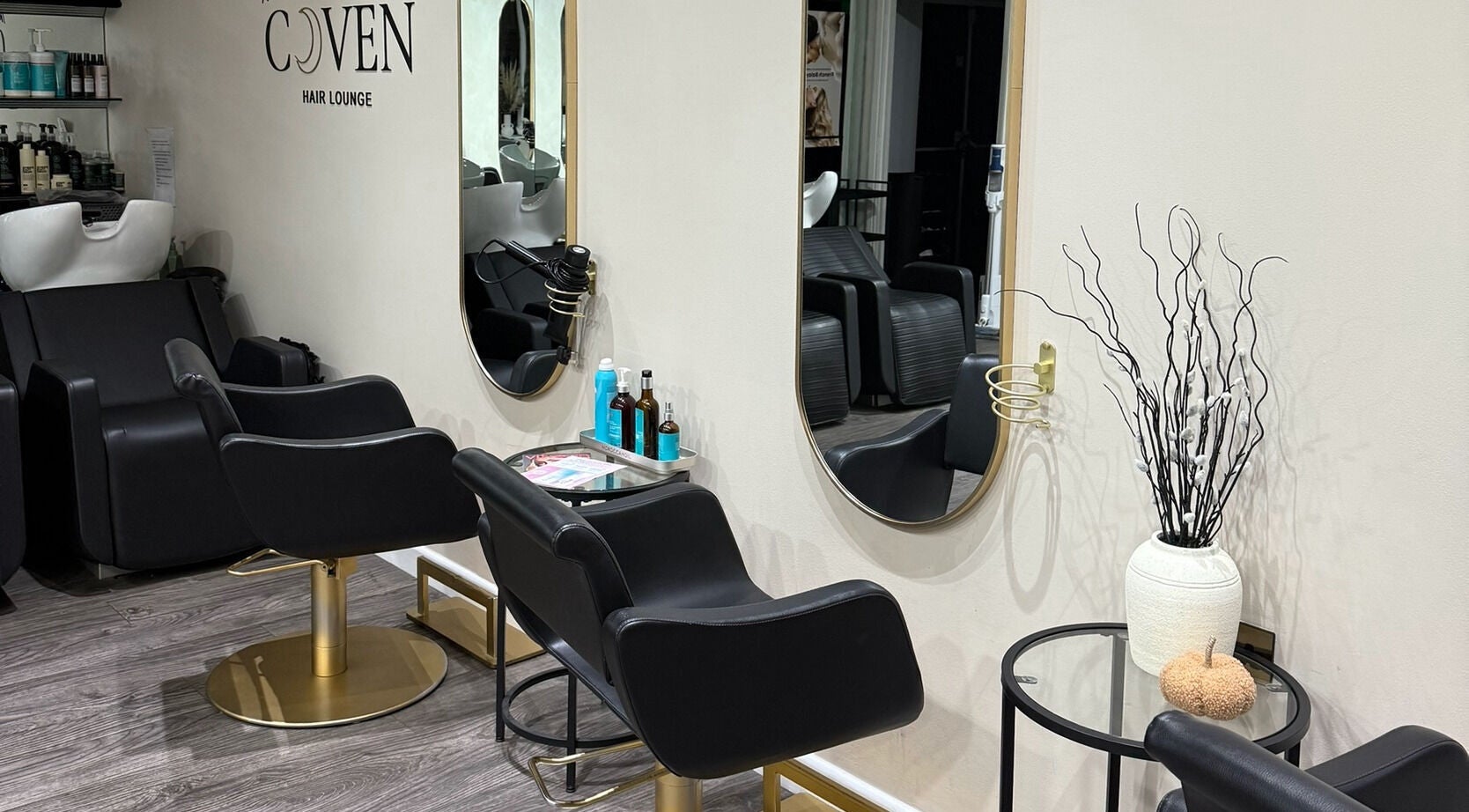 Modern salon chairs and mirrors at The Coven Hair Lounge, Aylesbury, England, GB.