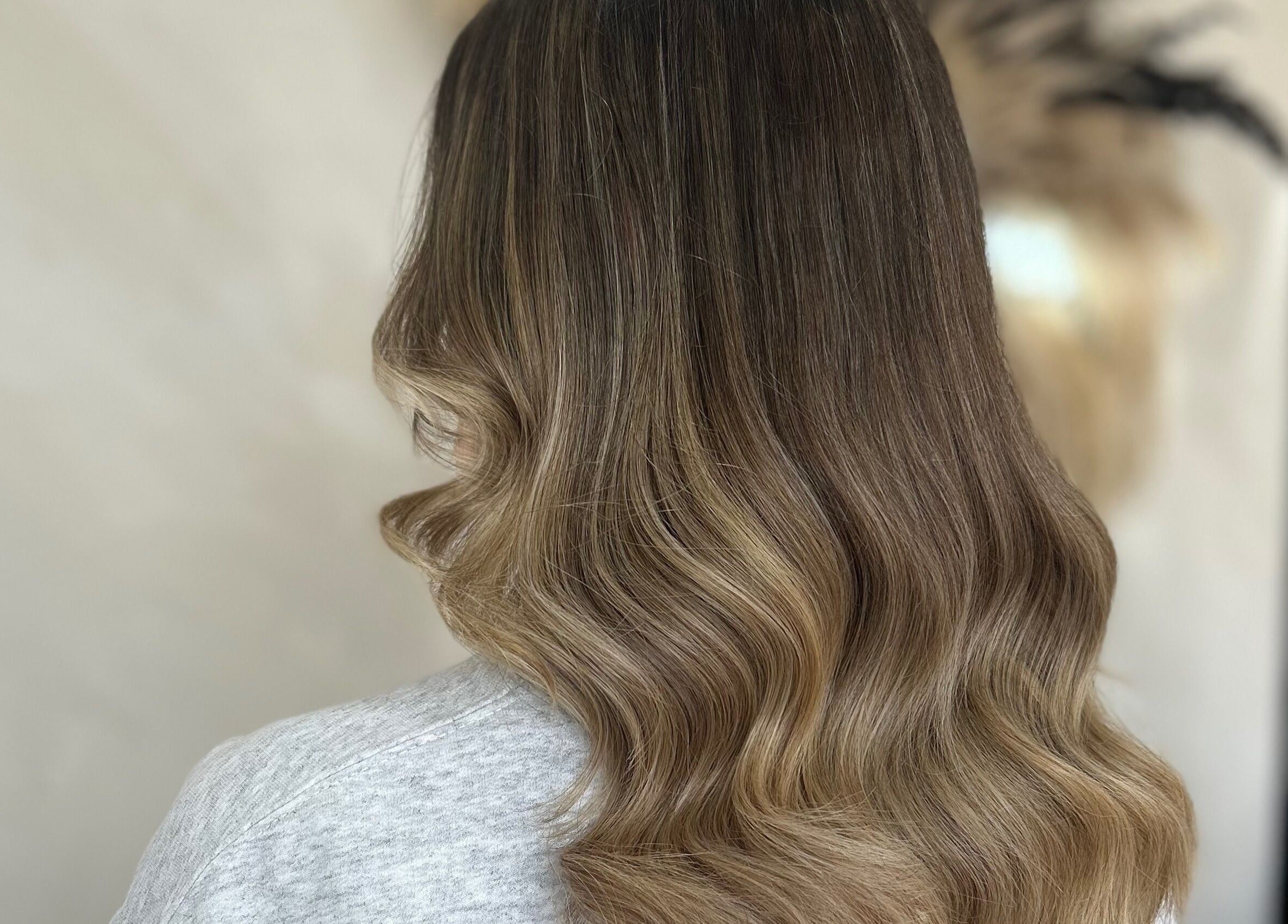Beautiful wavy hairstyle showcased at The Coven Hair Lounge, Aylesbury, England, GB.