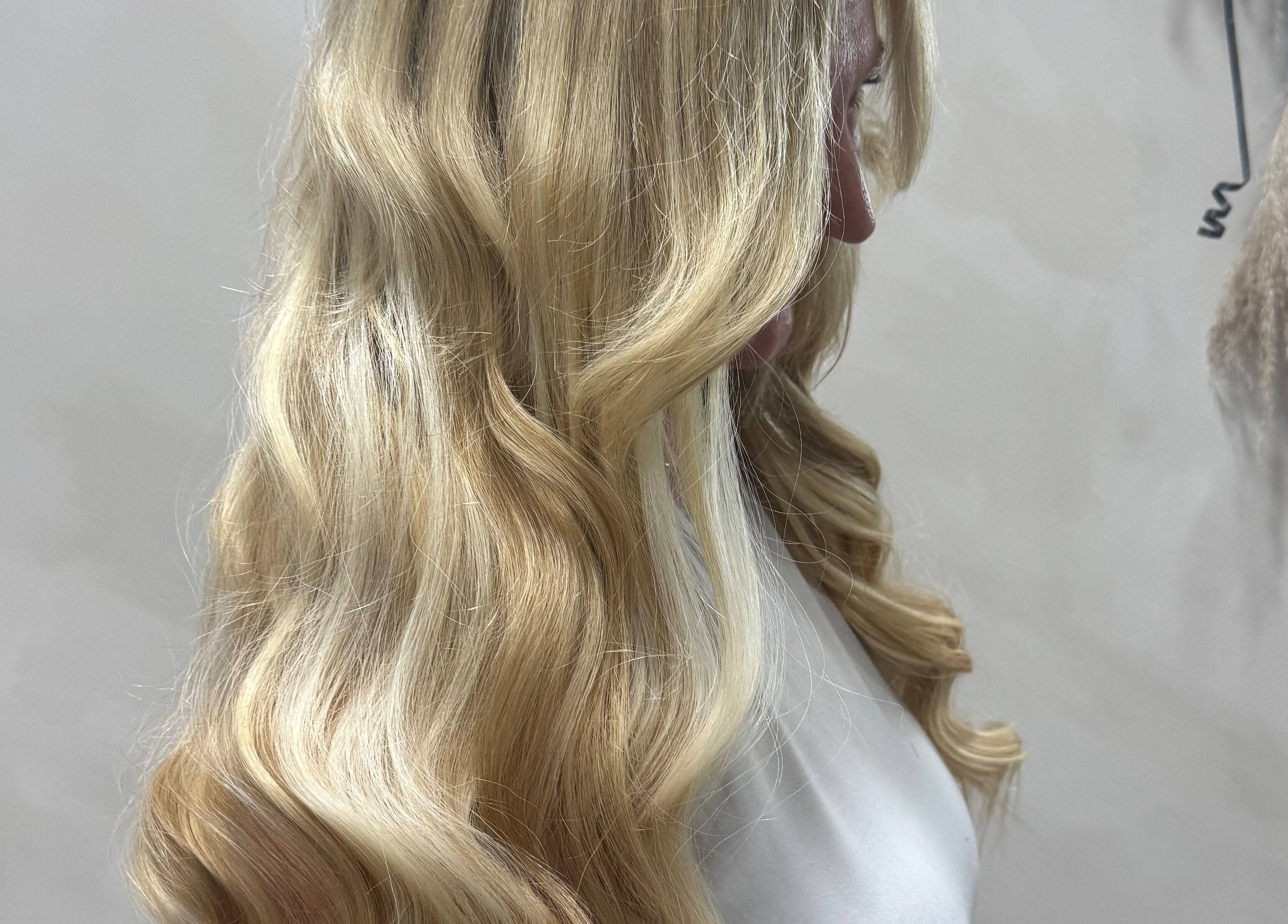 Blonde waves at The Coven Hair Lounge, Aylesbury, England, GB, showcasing luxurious hairstyling.