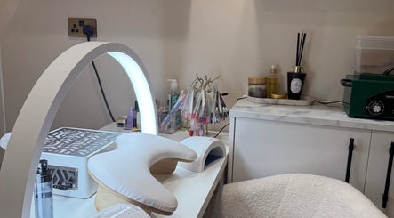 Manicure station at The Coven Beauty Lounge, Aylesbury, England, GB with nail tools and glow lamp.
