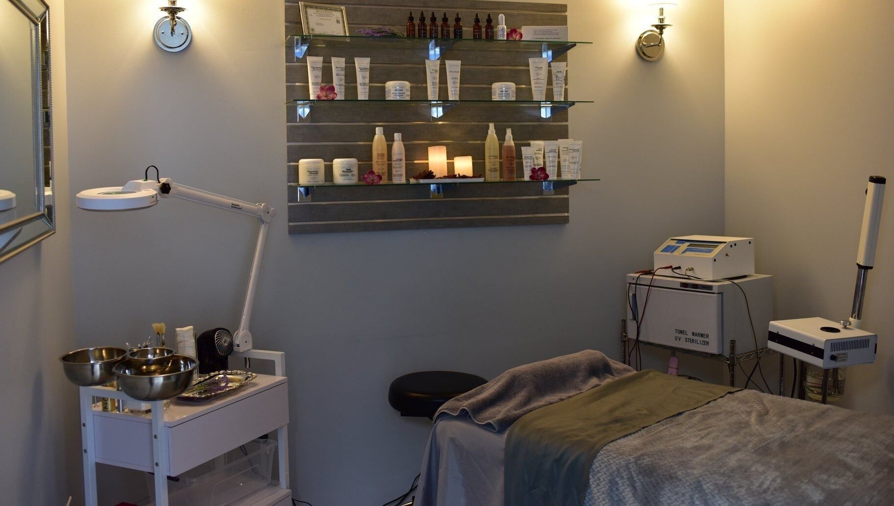 A serene treatment room at Face Reflections, Inc., Bloomingdale, Illinois, US with spa essentials displayed.