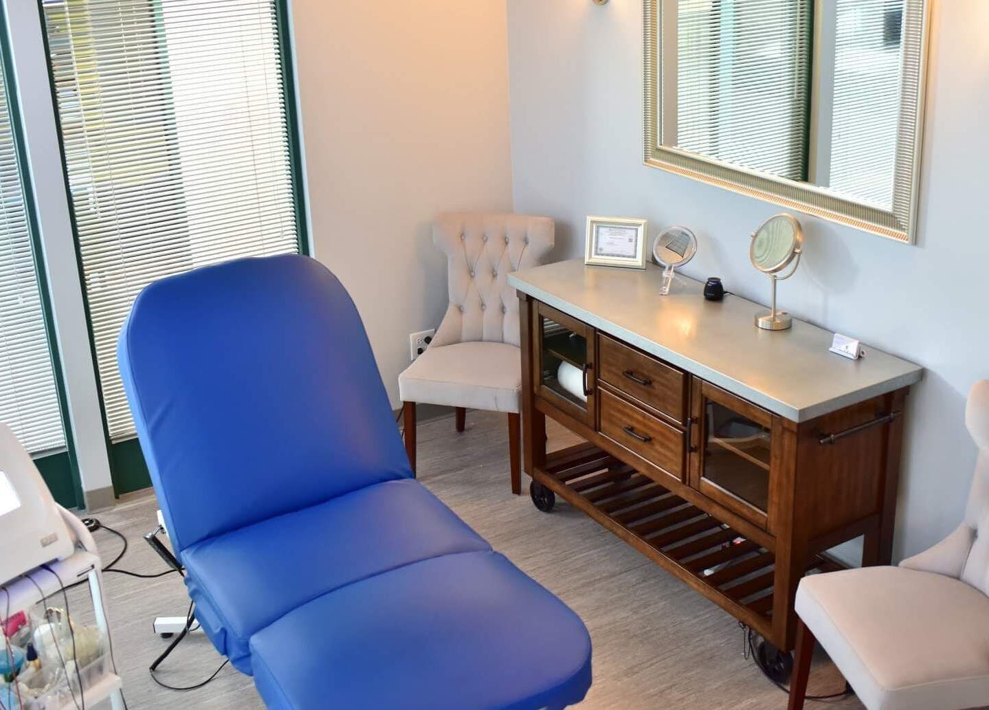Relaxing treatment room at Face Reflections, Inc. in Bloomingdale, Illinois, US with a spa chair and mirror.
