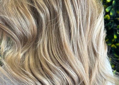 Blonde curls showcase at SBKHair&Beauty in Crestmead, Queensland, AU. Experience elegance and style.