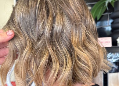 Blonde wavy hairstyle at SBKHair&Beauty in Crestmead, Queensland, AU, showcasing salon precision.
