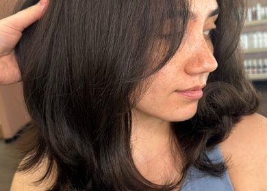 Woman with silky brown hair styled at SBKHair&Beauty in Crestmead, Queensland, AU.