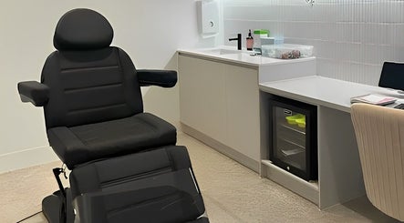 Modern treatment room at The Skin Element - Aesthetic Clinic, Southport, Queensland, AU with sleek black chair.