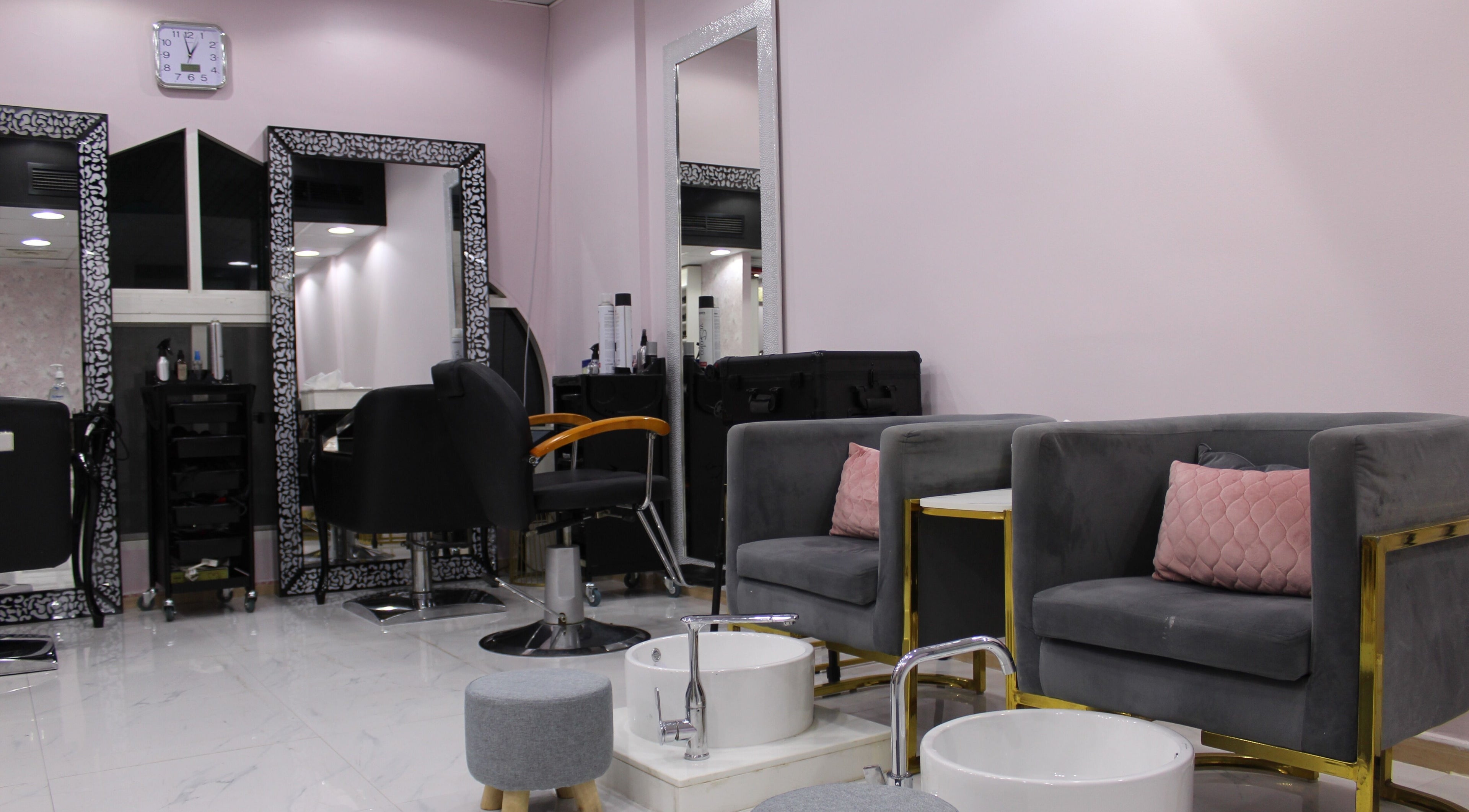 Interior of Elegance Essential Ladies Salon & Spa in Abu Dhabi, AE featuring stylish seating and modern decor.