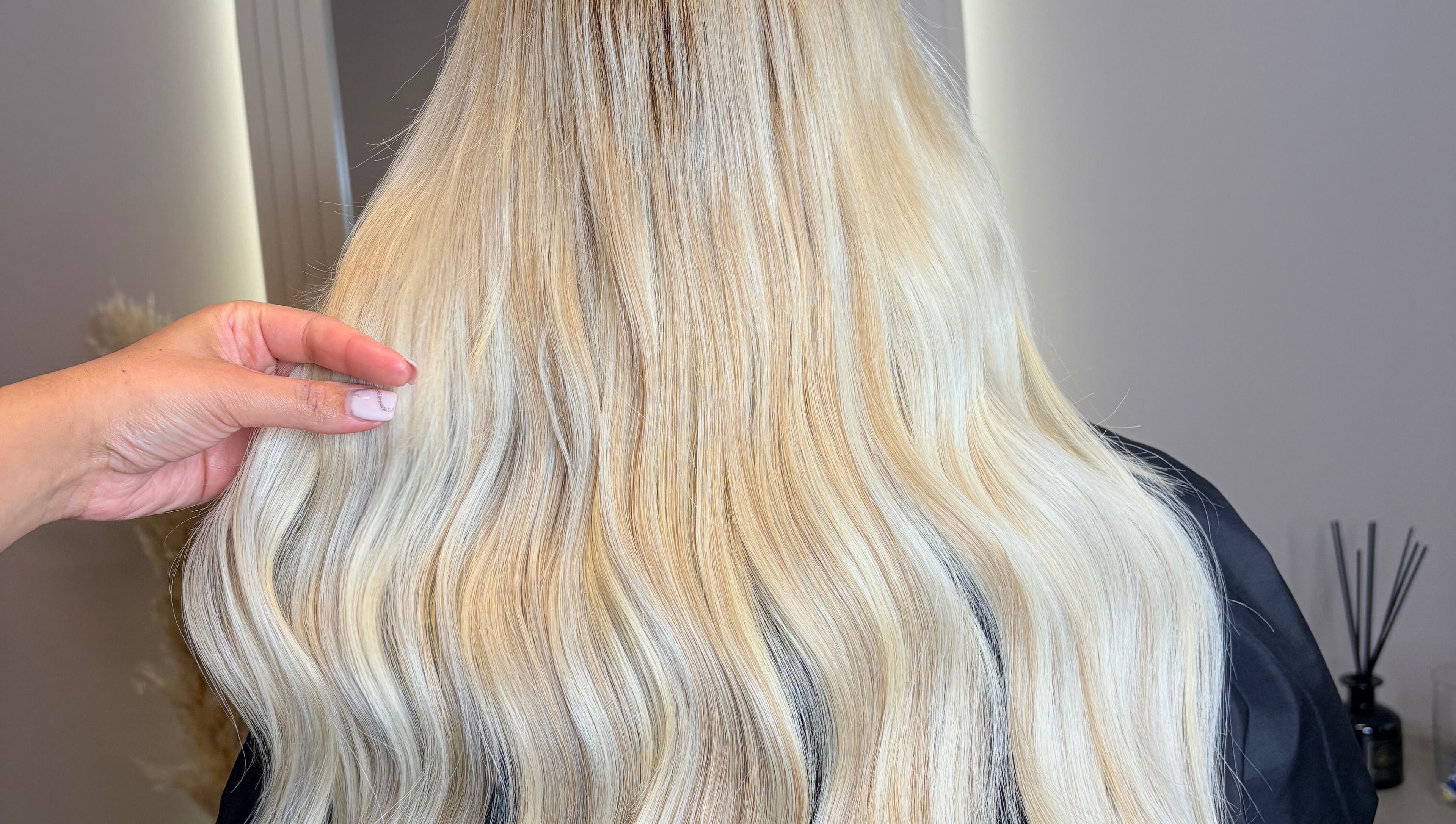 Long blonde hair extensions styled at Hair Extensions By Maria in Mexborough, England, GB.