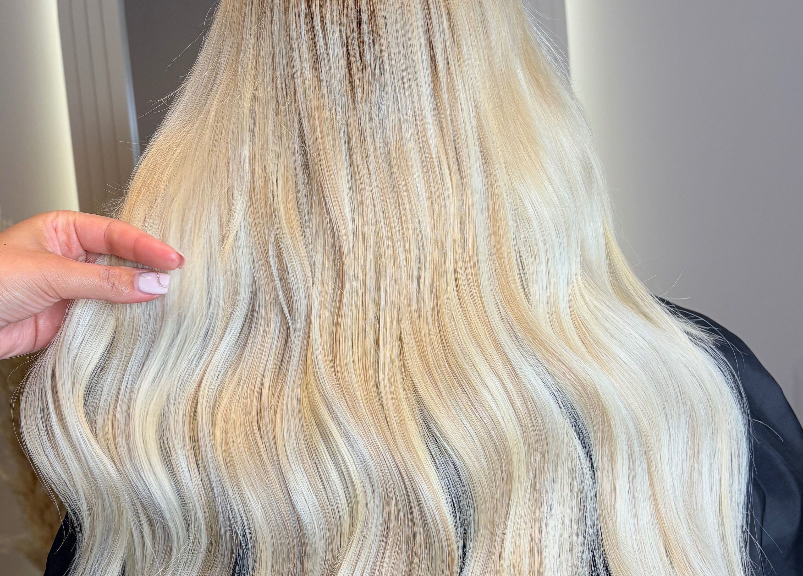 Long blonde hair extensions styled at Hair Extensions By Maria in Mexborough, England, GB.