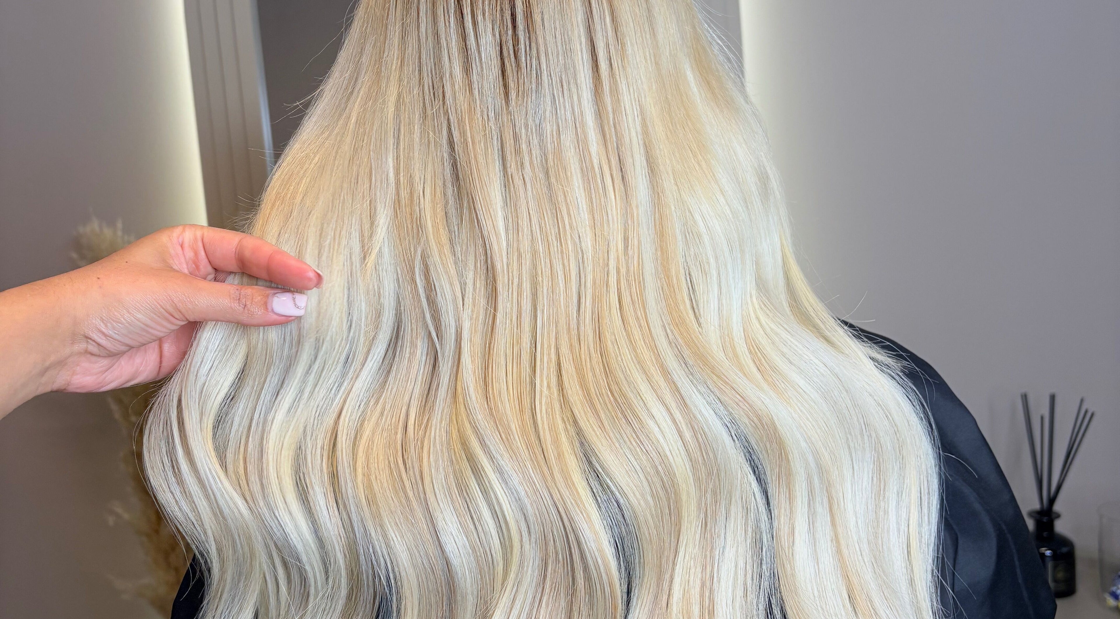 Long blonde hair extensions styled at Hair Extensions By Maria in Mexborough, England, GB.