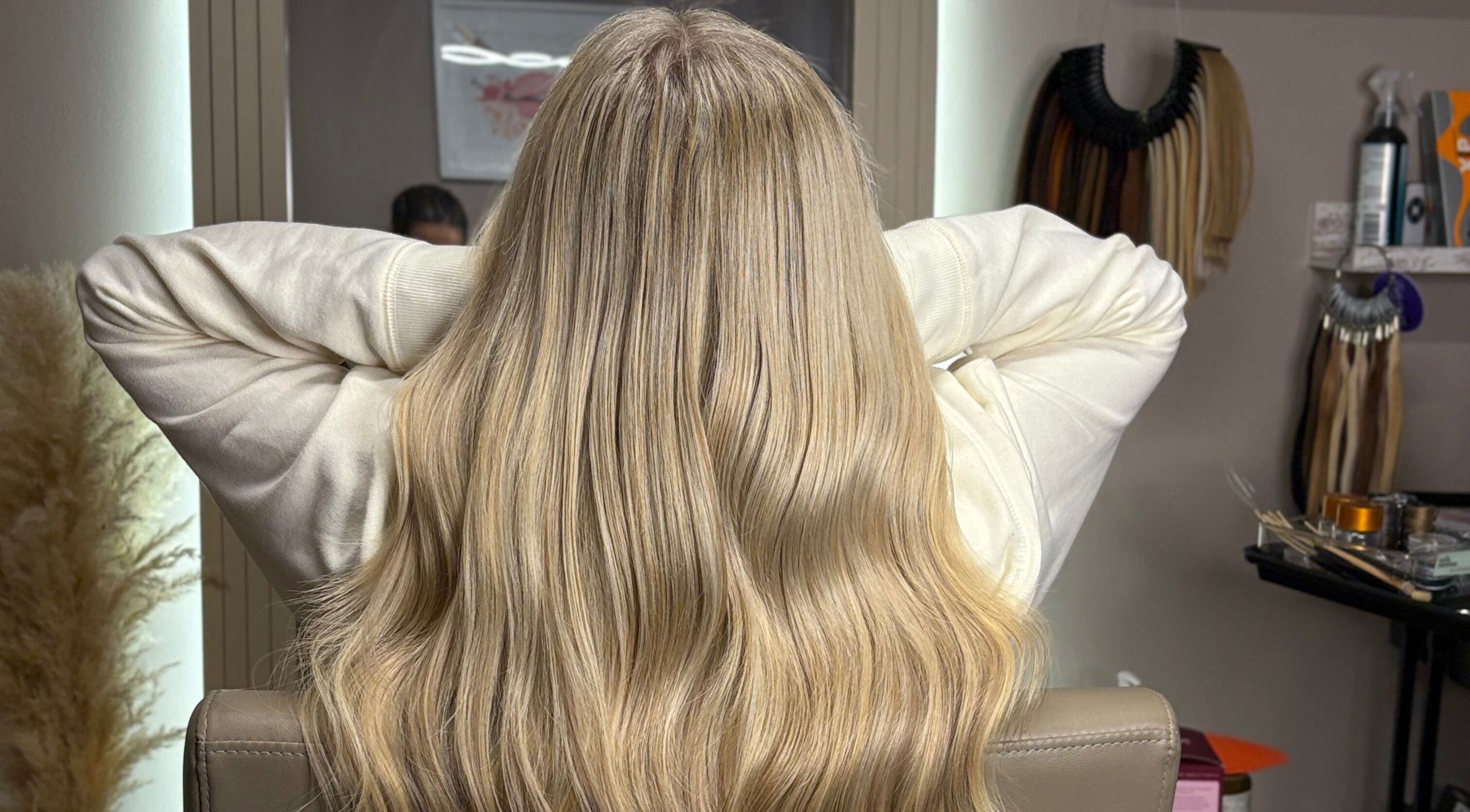 Blonde hair extensions at Hair Extensions By Maria, Mexborough, England, GB, showcase vibrant, smooth texture.