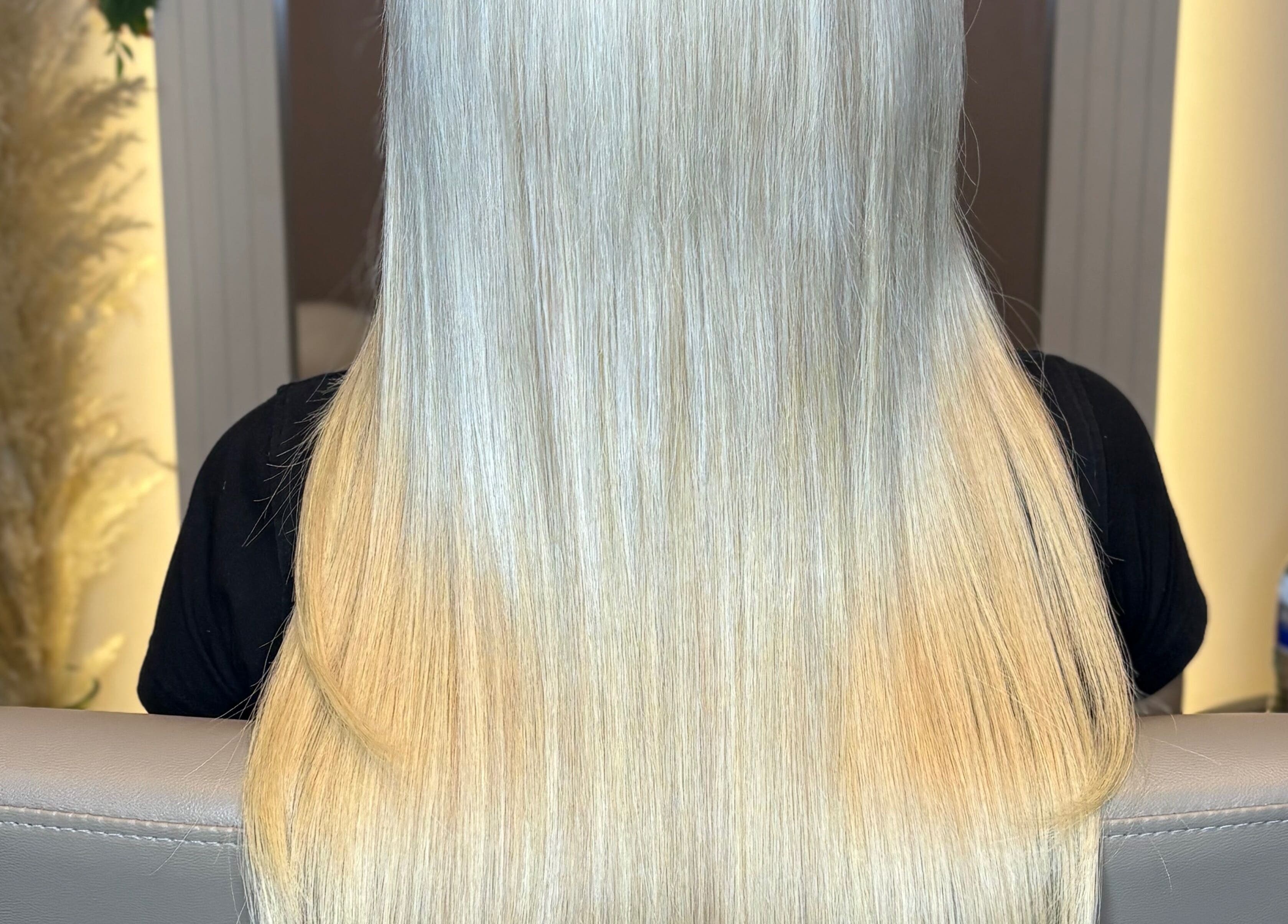 Elegant long blonde hair styled at Hair Extensions By Maria in Mexborough, England, GB, showcasing silky extensions.