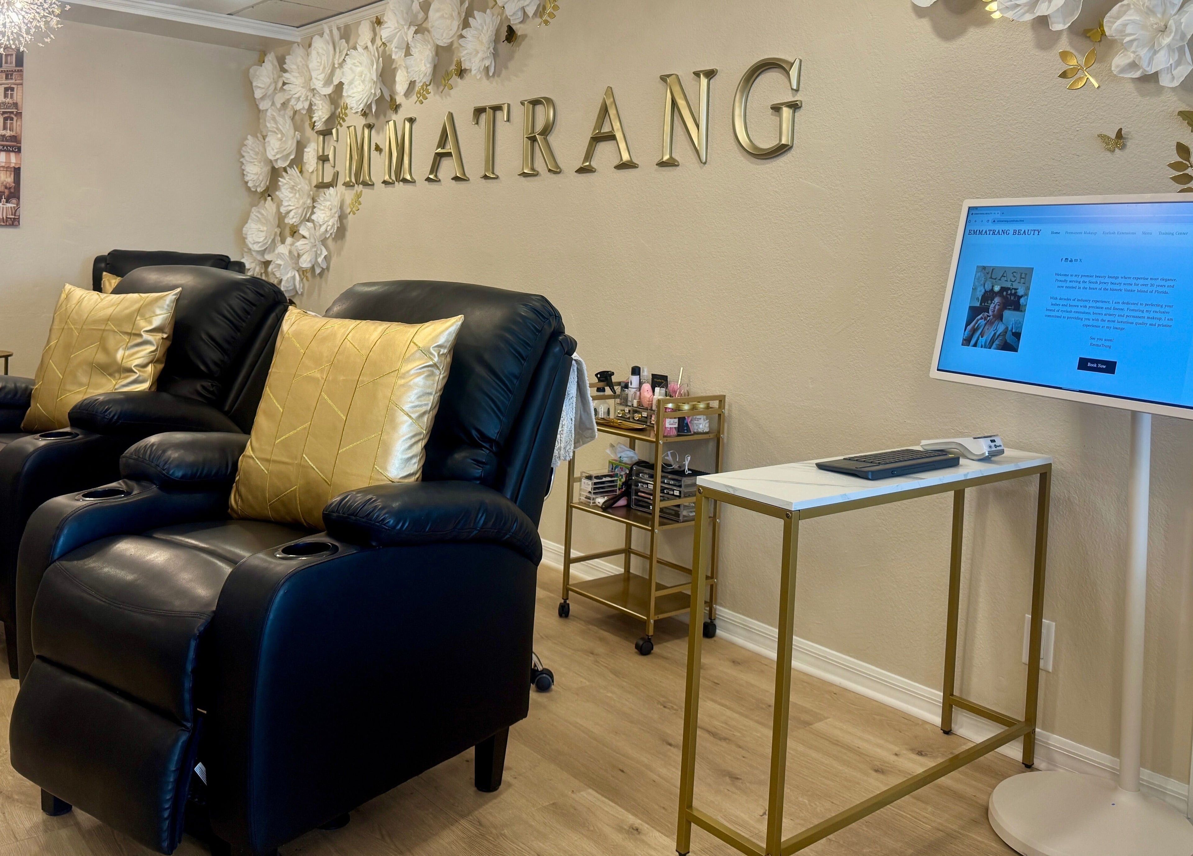 Relax in opulent leather chairs at Emma Trang Beauty, Venice, Florida, US. Elegant decor for a serene experience.