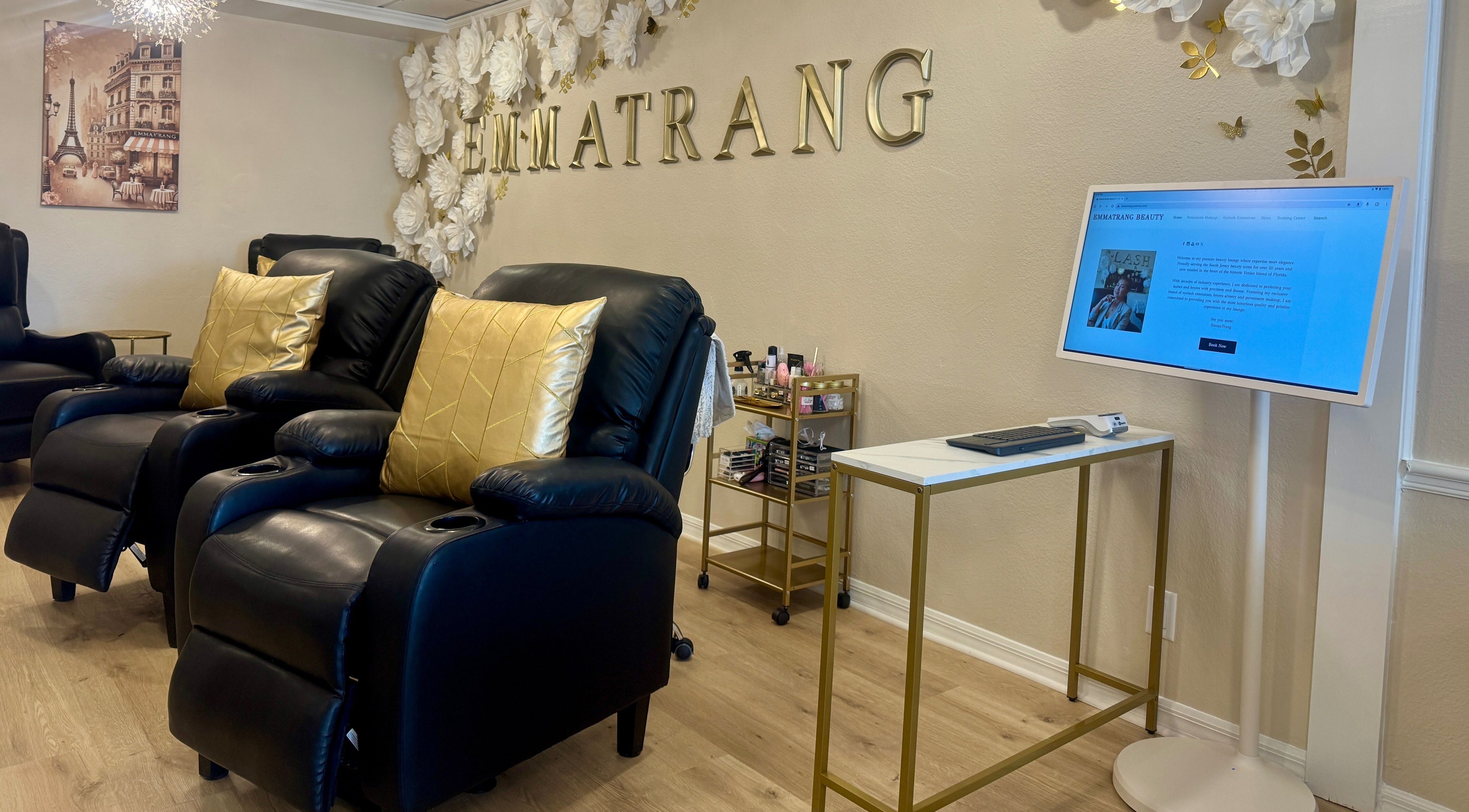 Relax in opulent leather chairs at Emma Trang Beauty, Venice, Florida, US. Elegant decor for a serene experience.
