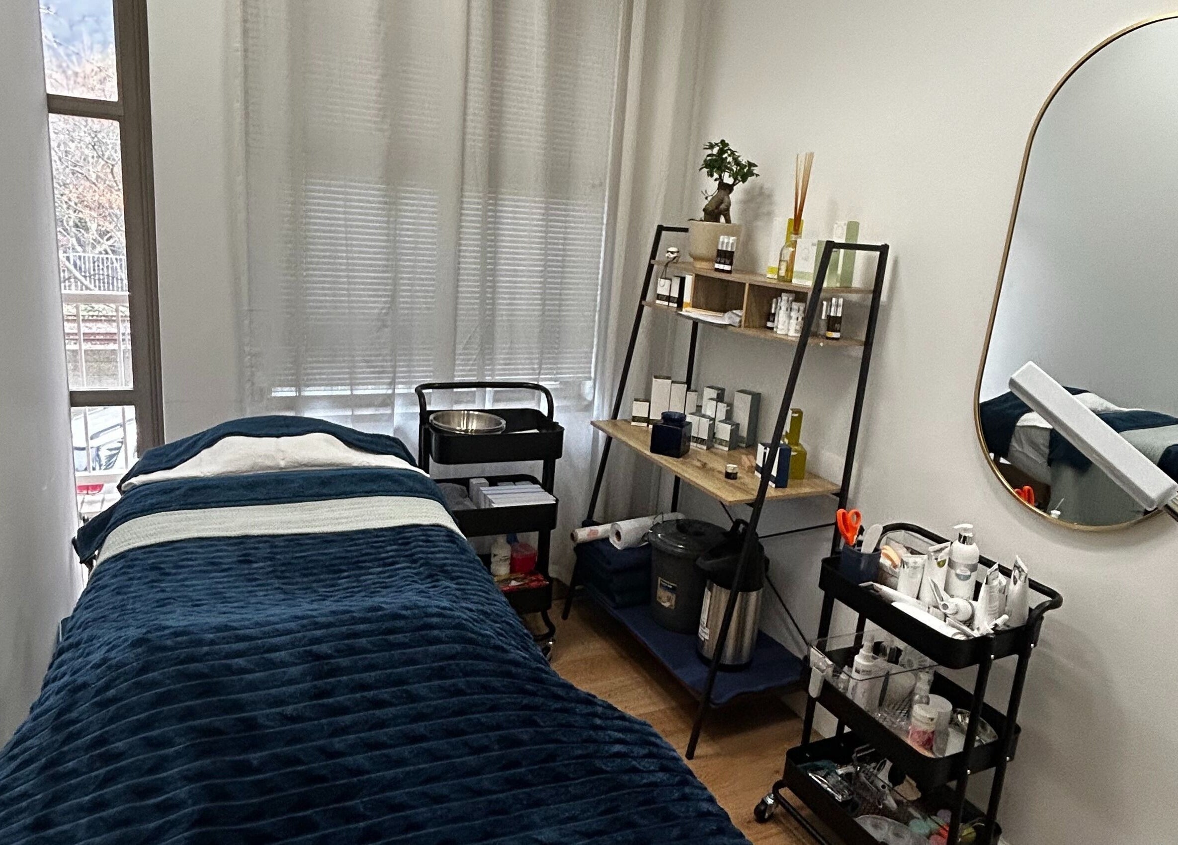 Cozy treatment room at Skin Reboot in Cape Town, Western Cape, ZA with plush bed and elegant decor.