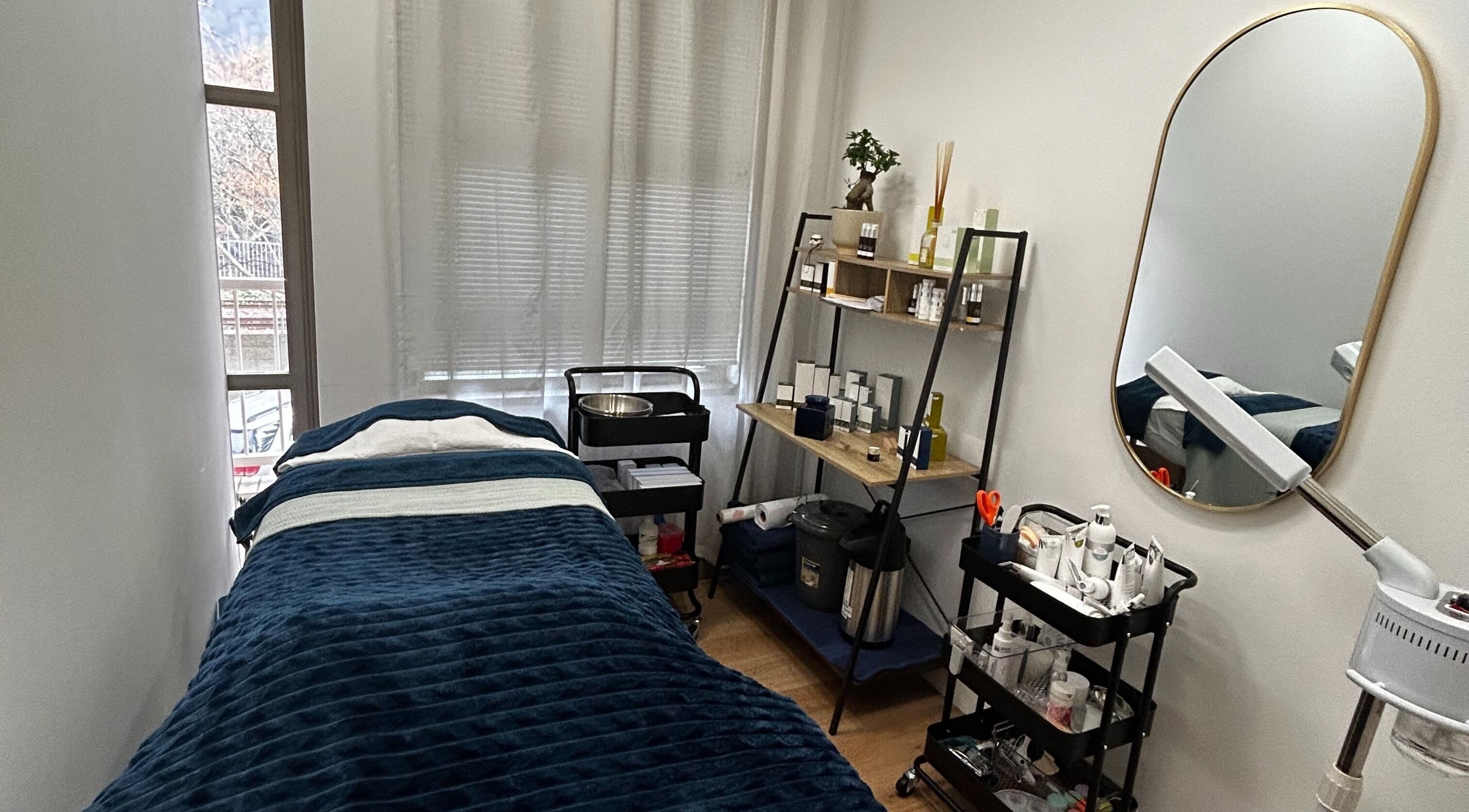 Cozy treatment room at Skin Reboot in Cape Town, Western Cape, ZA with plush bed and elegant decor.