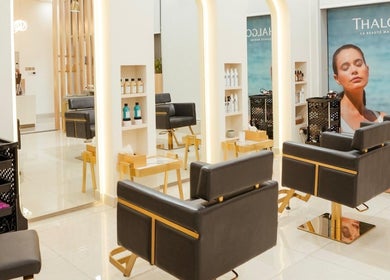 Elegant interior of Fresh N Fab Hair Beauty Ladies Salon in Dubai, Dubai, AE with modern styling chairs.