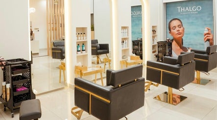 Elegant interior of Fresh N Fab Hair Beauty Ladies Salon in Dubai, Dubai, AE with modern styling chairs.