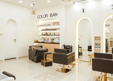 Chic interior of Fresh N Fab Hair Beauty Ladies Salon in Dubai, Dubai, AE showcasing modern chairs and styling stations.