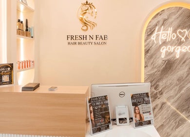 Reception area of Fresh N Fab Hair Beauty Ladies Salon in Dubai, Dubai, AE with elegant decor and branded signage.