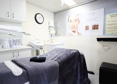 Elegant treatment room at Dolce Vita Beaute in Newtown, New South Wales, AU, featuring a plush massage table.