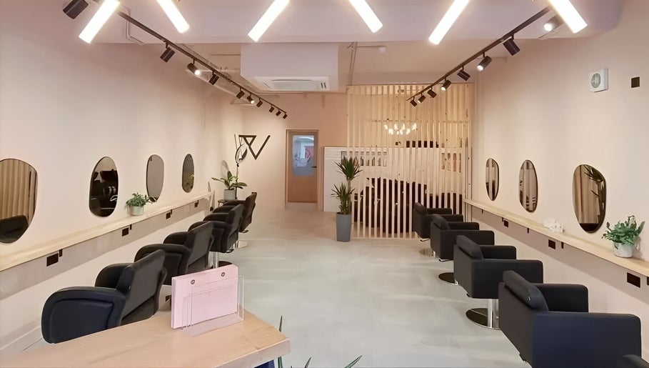 Stylish interior of Blend By Anna, Carlisle, England, GB with modern salon chairs and mirrors.