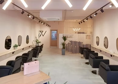 Stylish interior of Blend By Anna, Carlisle, England, GB with modern salon chairs and mirrors.