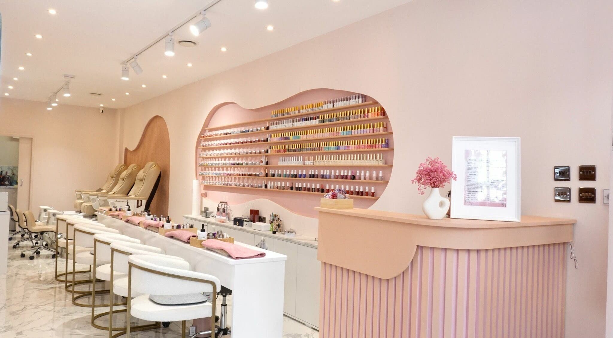 THE LOCE NAILS GARDEN in London, England, GB, featuring elegant nail stations and a vibrant polish display.