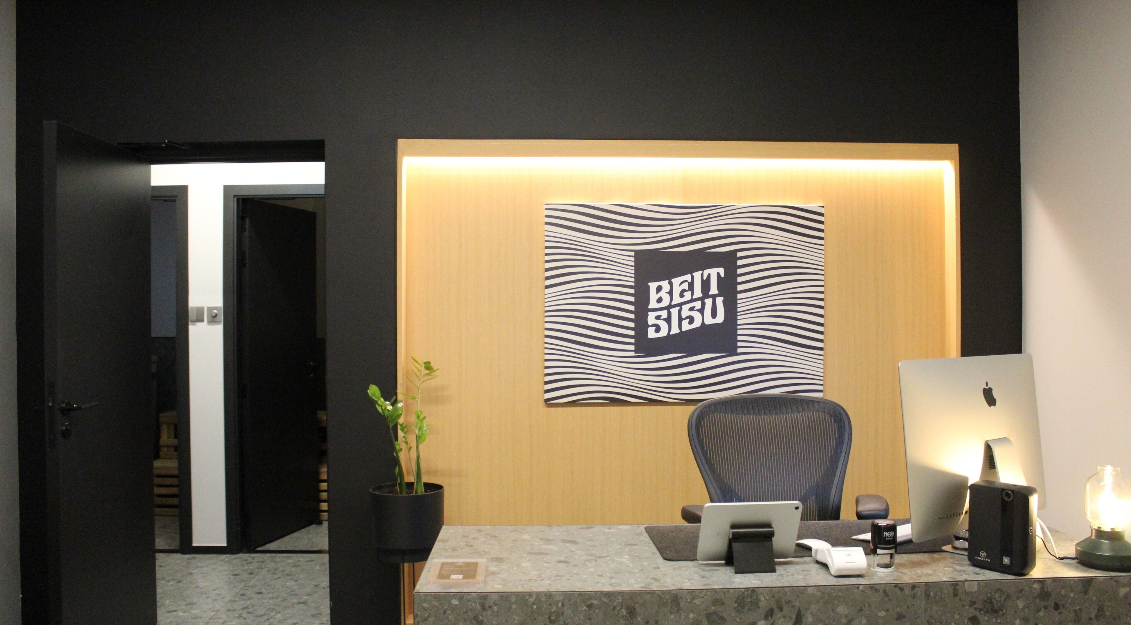 Reception area of Beit Sisu in Dubai, Dubai, AE, featuring modern decor and welcoming ambiance.